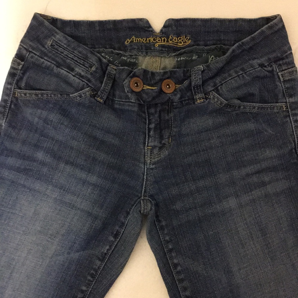 FadedAmerican Eagle jeans, double button in front.